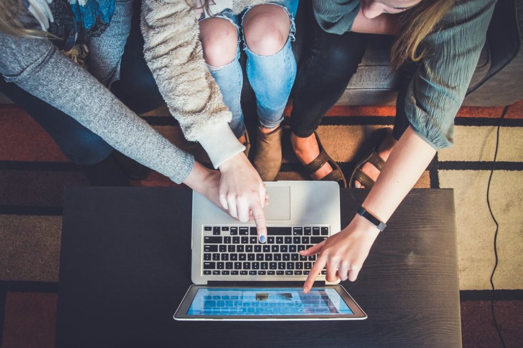 Employees shopping at an online company store to boost morale