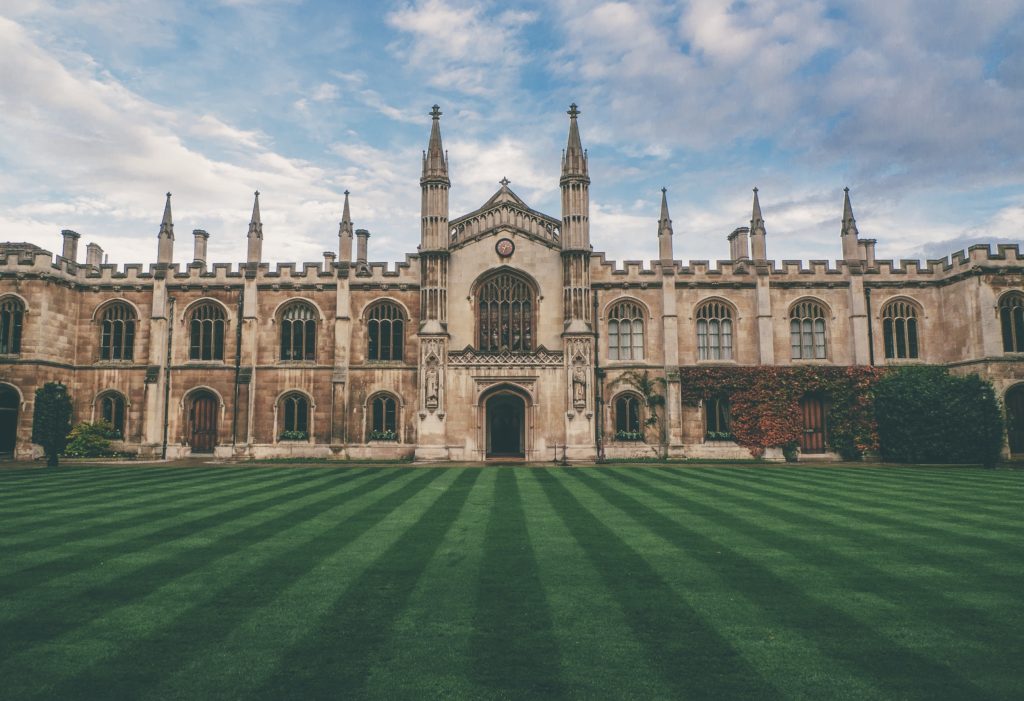 University building with a manicured lawn
