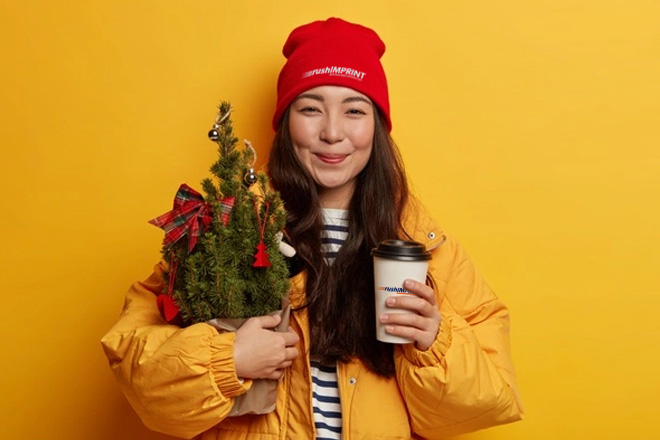 Woman wearing custom promotional apparel for winter holidays