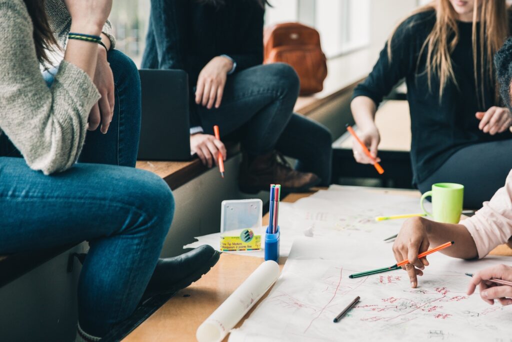 People planning a marketing campaign using branded products with logo