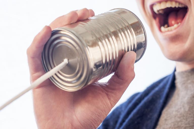 Man speaking to a can phone